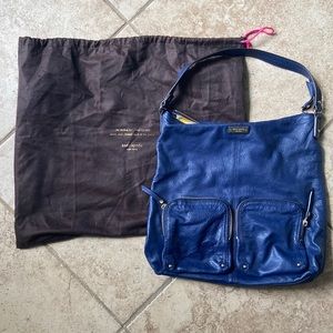 Kate Spade navy blue leather handbag with polka dot lining